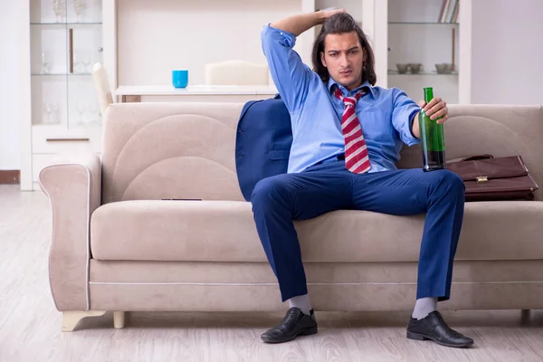 Young male employee being fired from his work at home — Stock Photo, Image