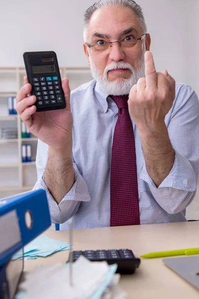 Old male accountant in budget planning concept in the office — Stock Photo, Image