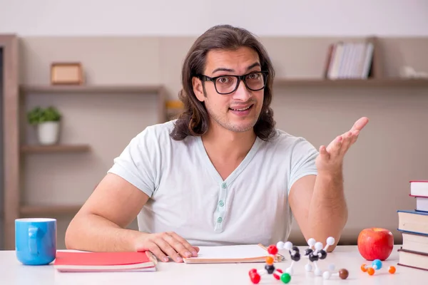 Young male student preparing for exams at home — Stock Photo, Image