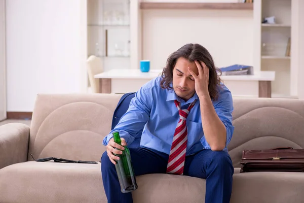 Young male employee being fired from his work at home — Stock Photo, Image