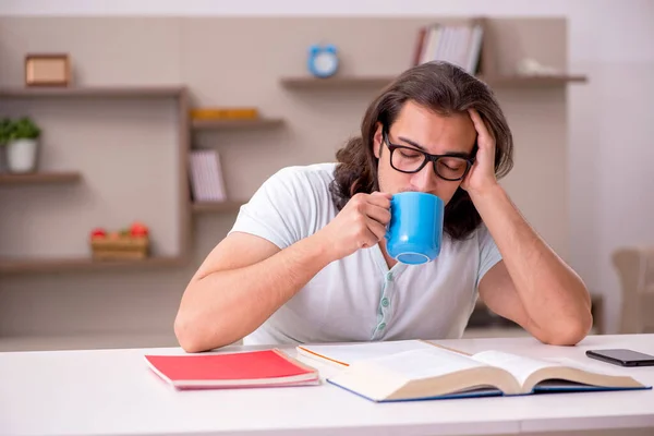 Young male student preparing for exams at home — Stock Photo, Image