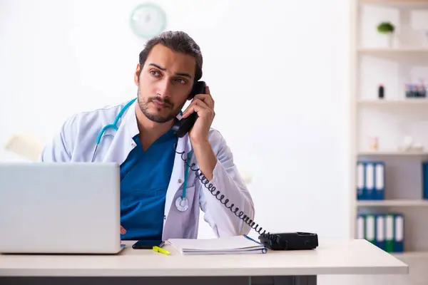 Young male doctor in telemedicine concept — Stock Photo, Image