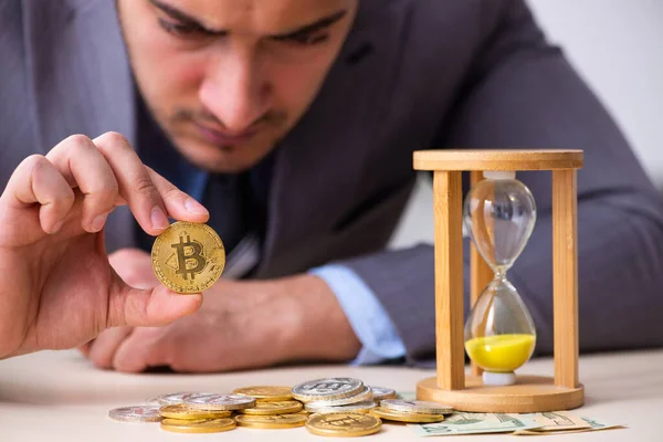 Young man earning money via Internet in time management concept — Stock Photo, Image