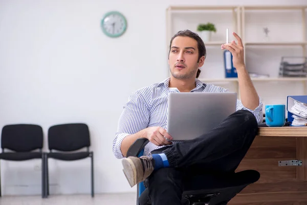 Young male bookkeeper working in the office — Stock Photo, Image