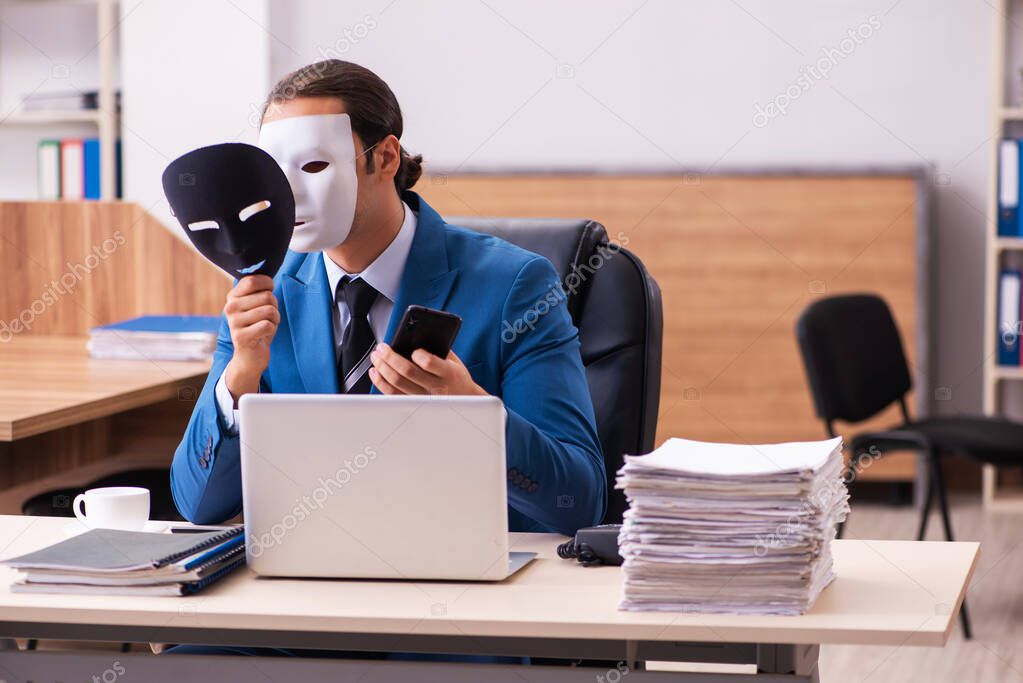 Young male employee wearing masks in the office