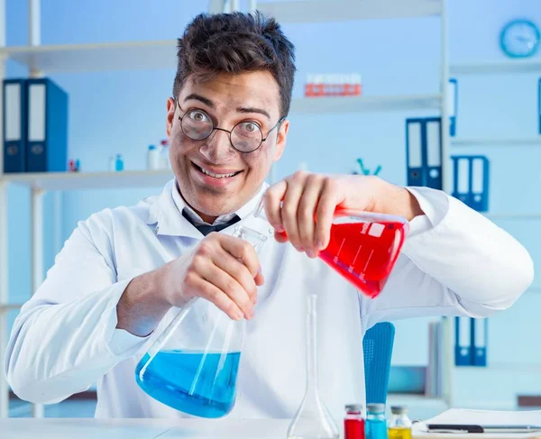 Funny mad chemist working in a laboratory — Stock Photo, Image