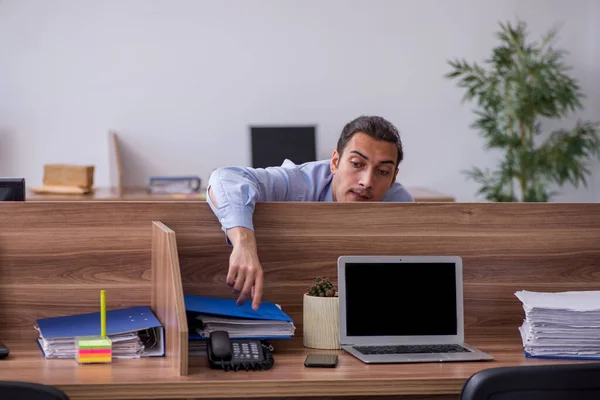 Young male employee in industrial espionage concept — Stock Photo, Image