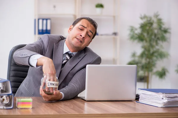 Young male employee in pension concept at workplace — Stock Photo, Image