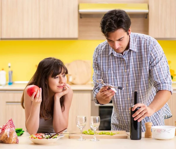 Young couple celebrating wedding anniversary at kitchen — Stock Photo, Image