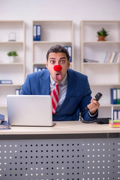 Funny employee clown working in the office — Stock Photo, Image