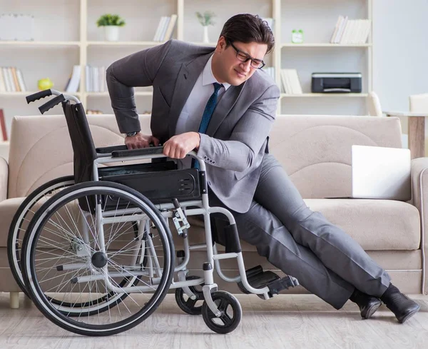 Dsabled businessman on wheelchair working home — Stock Photo, Image
