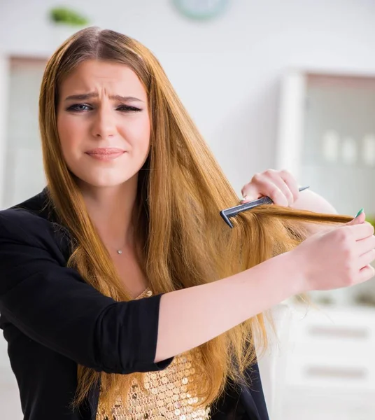 Young woman frustrated at her messy hair — Stock Photo, Image