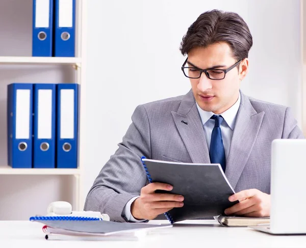 Young handsome businessman employee working in office at desk — Stock Photo, Image