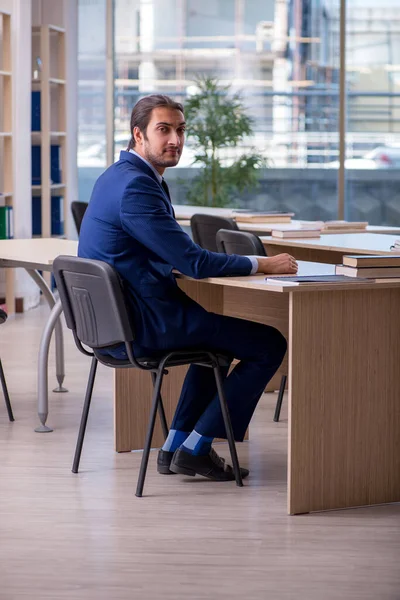 Young male teacher in suit in the classroom — Stock Photo, Image