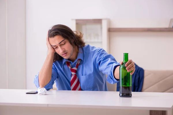 Young male employee being fired from his work at home — Stock Photo, Image