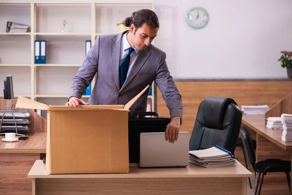 Young male employee being dismissed from his work — Stock Photo, Image