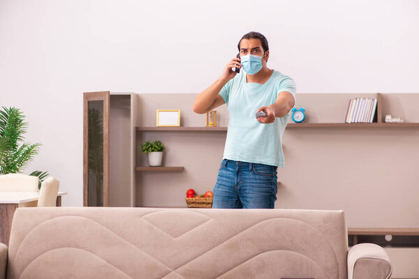 Young man boring at home during pandemic