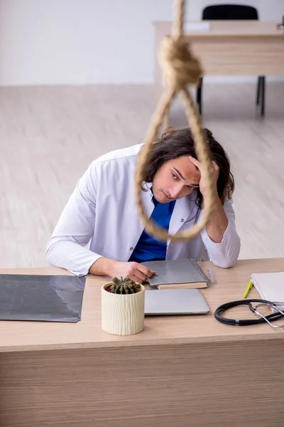 Young male doctor committing suicide in the hospital — Stock Photo, Image