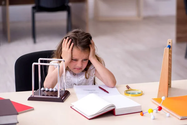 Small girl preparing for exams at home — Stock Photo, Image