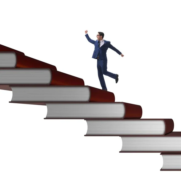 Businessman student climbing the ladder of education books — Stock Photo, Image