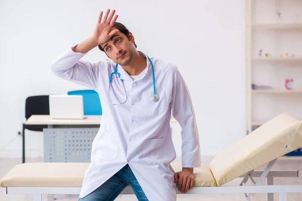 Young male doctor working in the clinic — Stock Photo, Image