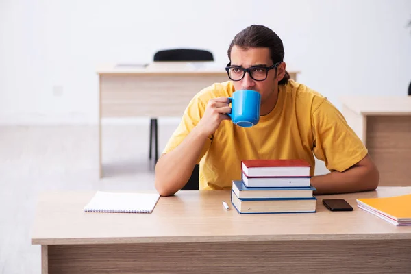 Young male student having break during exam preparation — Stock Photo, Image