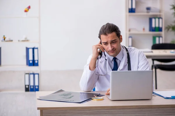 Young male doctor in telemedicine concept — Stock Photo, Image