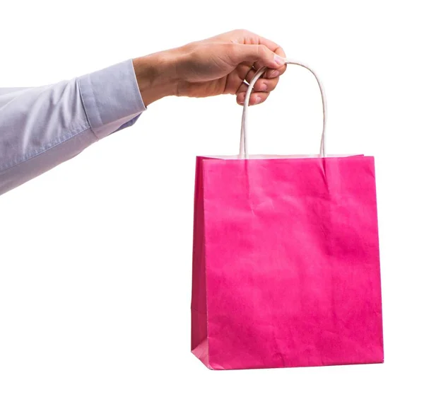 Hand holding shopping bags with christmas shopping on white back — Stock Photo, Image