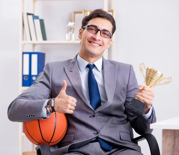 Businessman with prize cup for achievements in office — Stock Photo, Image