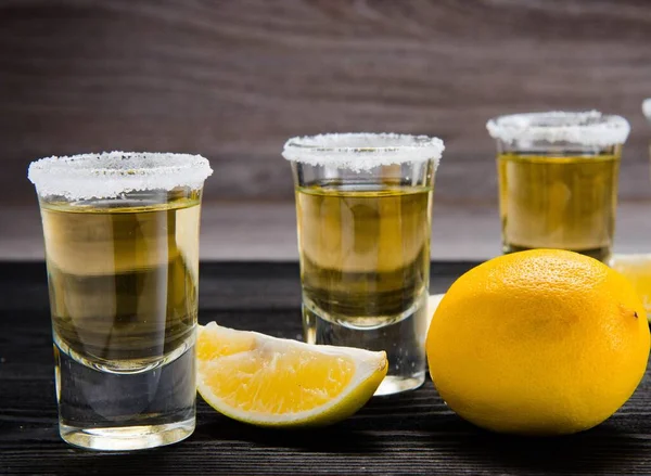 Tequila drink served in glasses with lime and salt — Stock Photo, Image