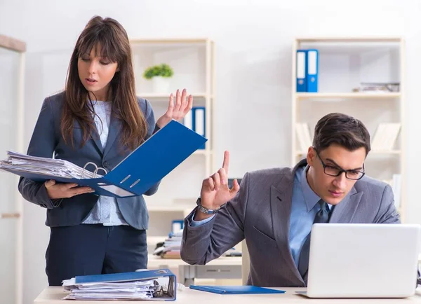 Man and woman working in the office