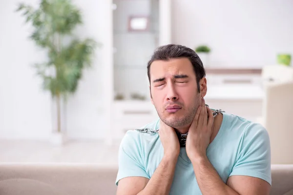 Young man suffering from sore throat — Stock Photo, Image