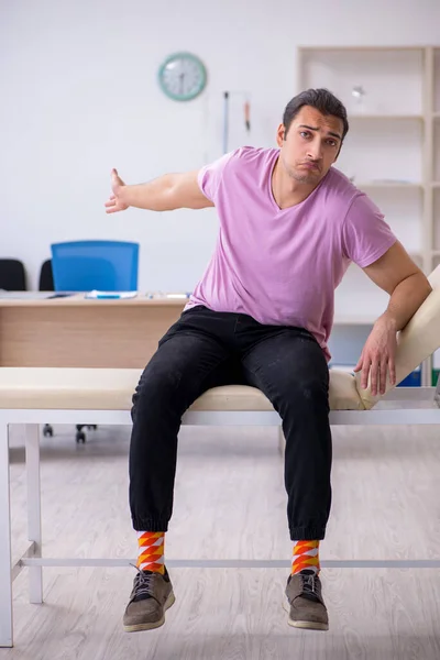 Young male patient waiting for doctor in the clinic — Stock Photo, Image