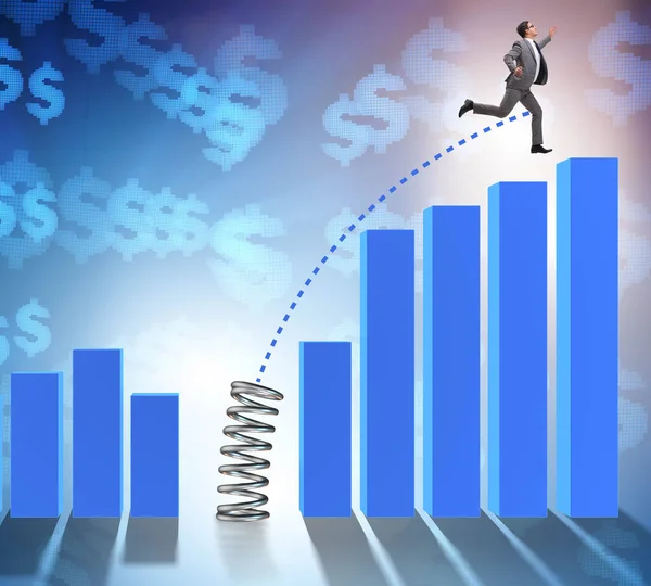 Business people jumping over bar charts — Stock Photo, Image