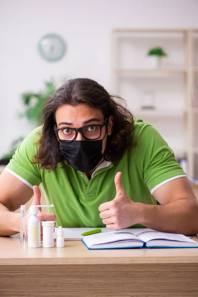 Young man student studying at home in self-isolation concept — Stock Photo, Image