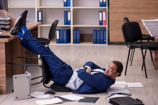 Young male businessman employee unhappy with his work — Stock Photo, Image