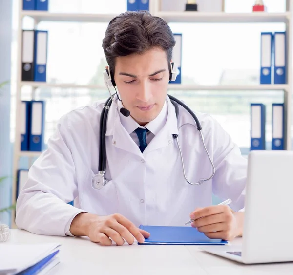Young male doctor in telehealth concept — Stock Photo, Image