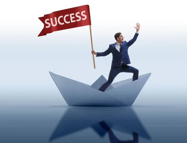 Businessman riding paper boat ship in success concept — Stock Photo, Image