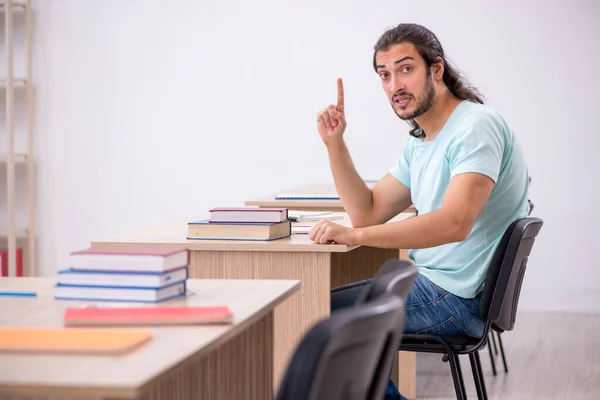 Young male student in the classroom during pandemic — Stock Photo, Image