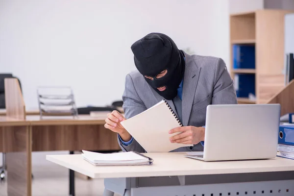 Young male employee in industrial espionage concept — Stock Photo, Image