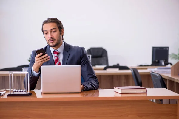 Young man businessman employee sitting in the office — Stock Photo, Image