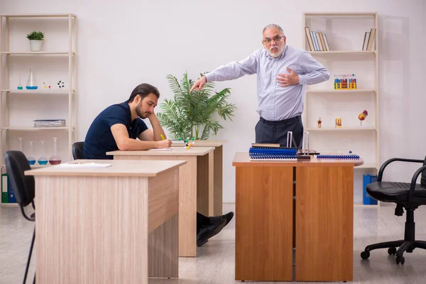 Old male teacher feeling bad during individual lesson — Stock Photo, Image