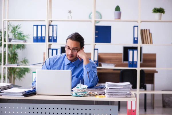 Young male bookkeper in budget planning concept — Stock Photo, Image