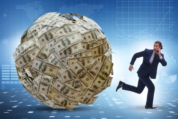 Businessman running away from dollar ball — Stock Photo, Image