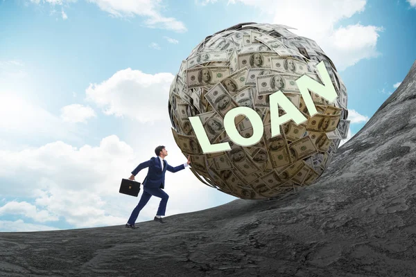 Businessman pushing dollar uphill in debt loan concept — Stock Photo, Image