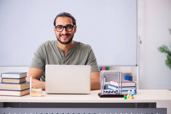 Young male student physicist in tele-education concept — Stock Photo, Image