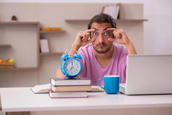 Young male student preparing for exams at home — Stock Photo, Image