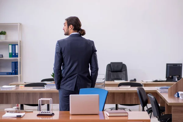 Young man businessman employee sitting in the office — Stock Photo, Image