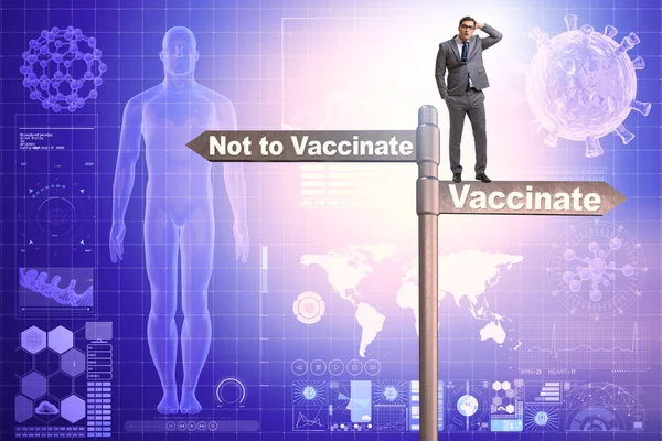 ワクチン接種のジレンマに直面するビジネスマン — ストック写真