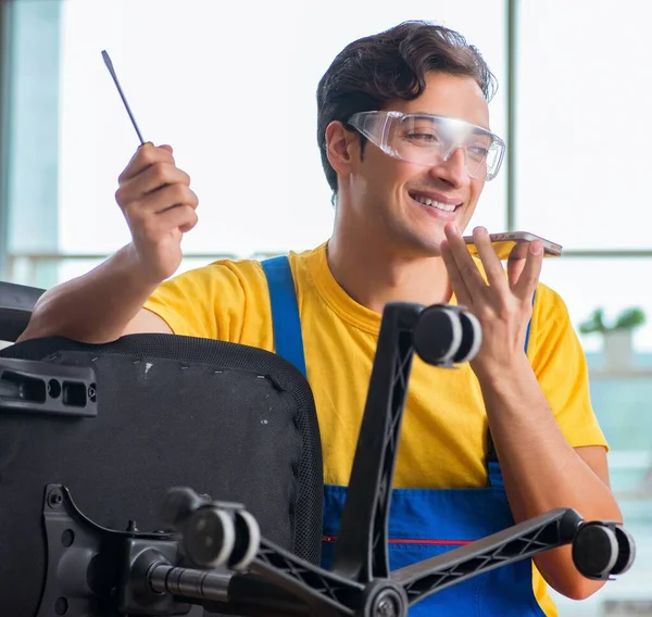 Furniture repairman working on repairing the chair — Stock Photo, Image